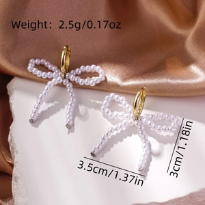 Detailed view of pearl bow earrings with size 3.5cm x 3cm and weight 2.5g specifications
