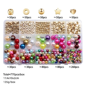 Flat lay of 770pcs DIY jewelry kit with pearls and gold beads in a 15-grid organizer box