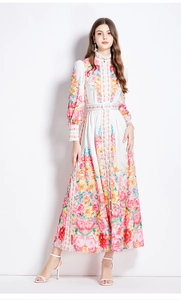 Detailed view of long sleeve floral dress with stand collar and single-breasted design