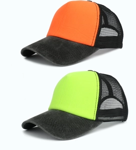 Detail of two-tone washed cotton trucker caps with breathable mesh and distressed brims