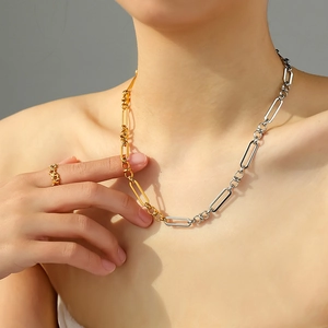 Two-tone mixed chain necklace in gold and silver with minimalist star open ring jewelry
