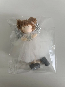 Detail of white mesh skirt angel doll ornament with silver wings and snowflake