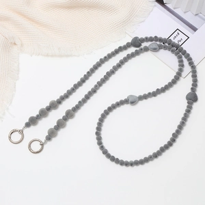 Gray flocked bead phone lanyard with heart accents and silver clasp on white background