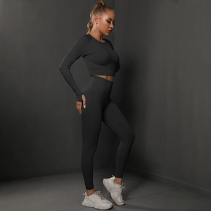 Side view of black seamless yoga set showing slim fit crop top and high waist leggings