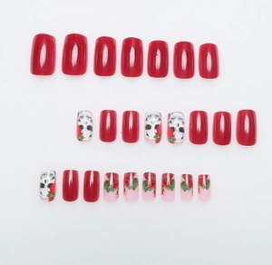 Detailed display of 24 press-on nails with red skull and rose gothic floral prints