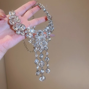 Detailed view of luxury sparkling rhinestone round tassel pendant necklace for women