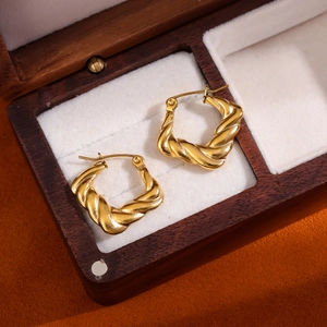 18K gold plated stainless steel square twisted hoop earrings displayed in a jewelry box