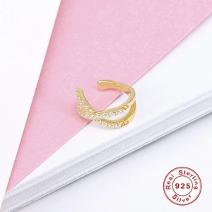 Close-up of S925 sterling silver crisscross ear cuff with sparkling zircon inlay