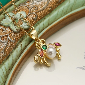 Gold-plated animal pendant necklace featuring white pearl and colorful zircon stones