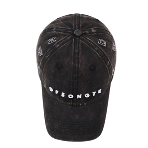 Vintage washed black cotton baseball cap with embroidered lettering and distressed finish