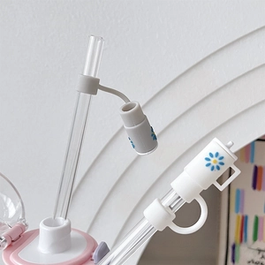 Detail view of silicone straw covers with floral patterns and a clear 10mm straw