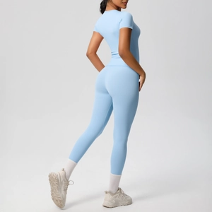 Detail view of high-elastic light blue yoga set showing slim fit top and high waist leggings