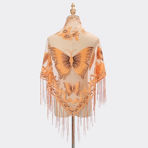 Orange lace shawl featuring embroidered butterflies and delicate tassels on a mannequin