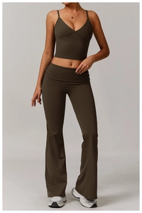 Detail of dark brown yoga set featuring V-neck cropped tank top and flared high-waisted pants