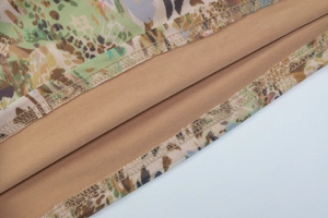 Detail of khaki camo print mesh fabric with high-quality double-needle lockstitch seam