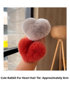 Close-up of grey and brick red Rex rabbit fur heart-shaped hair ties measuring 8cm