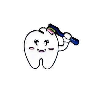 Cute cartoon tooth enamel pin holding a blue toothbrush with pink toothpaste on white base
