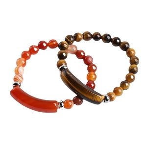 Tiger eye and red agate beaded bracelet set with curved silver tubes on white background