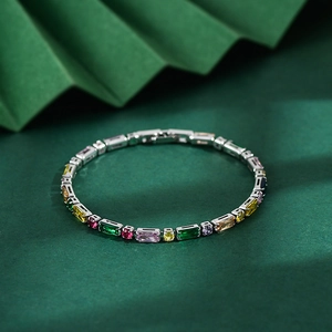 Macro view of multi-colored zircon stones on a silver metal chain bracelet