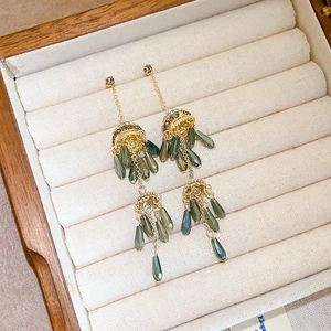 Bohemian tassel earrings with gold jellyfish accents and dark green crystal drops