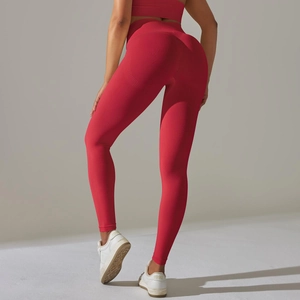 Close-up of red seamless high-waist yoga pants showing butt-lifting and contouring effect