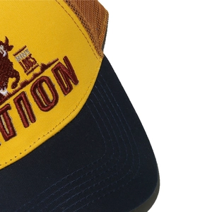 Close-up of 3D bull embroidery and contrast mesh stitching on a vintage trucker hat