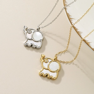 Minimalist elephant pendant necklace with shell inlay and rhinestones in gold and silver