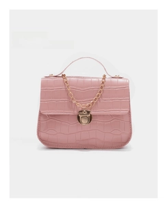Detail of pink faux crocodile leather bag with gold chain and metal clasp closure