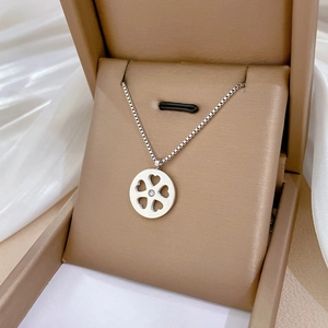 Silver flower pendant necklace with four-heart clover design on a box chain