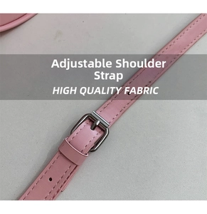 Detail of pink adjustable shoulder strap with silver buckle and high quality fabric texture