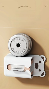 Strong wall-mounted white bear tissue box holding heavy barbell plates to show durability