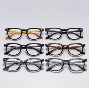 Macro shot showing six assorted colors and textures of vintage square eyeglass frames