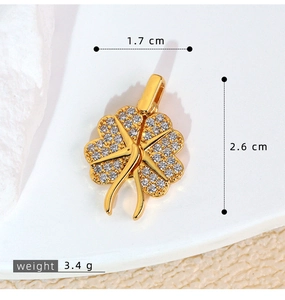 Macro shot of gold four-leaf clover pendant with sparkling pavé cubic zirconia details