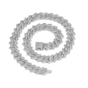 Macro shot of 15mm silver Cuban link necklace with sparkling crystals and box clasp