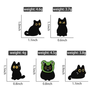Detailed size and weight chart for five black cat enamel pins with measurements