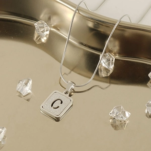 Silver snake chain necklace with frosted glitter rectangle pendant featuring letter C