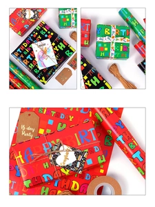 Close-up of Happy Birthday gift wrapping paper set with colorful twine and tags