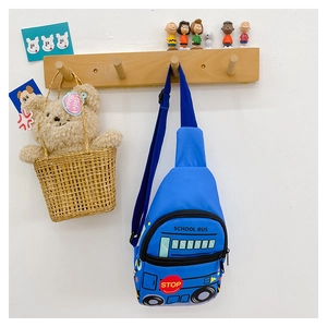 Detail of blue school bus kids chest bag hanging on a hook with cute decorations