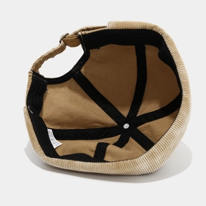 Internal structure of brown corduroy docker cap with reinforced bands and metal buckle