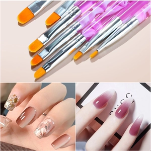 Pink marble nail art brush set with diverse orange bristles for professional manicure