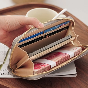 Gray quilted long zip-around wallet with large capacity slots and mobile phone storage