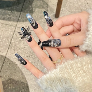 Handmade long coffin press-on nails with dark blue glitter, 3D bows, and luxury rhinestones
