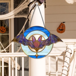 Macro detail of Halloween acrylic hanging charm with purple bat design and silver chain