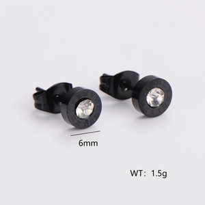 Macro shot of 6mm black Roman numeral earrings with a central sparkling crystal stud