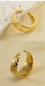 Detailed view of textured 18k gold plated open ring with diagonal striped embossing