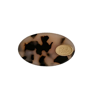 Minimalist acetate tortoiseshell oval hair clip with elegant golden logo detail
