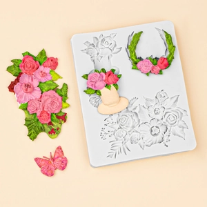 White silicone mold featuring detailed rose bouquets and butterfly shapes for cake decor