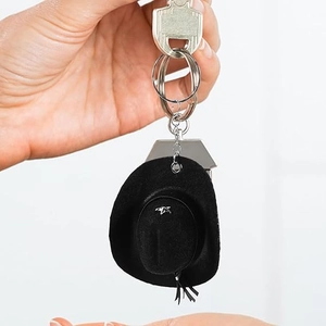 Close-up of a 8cm black mini cowboy hat keychain with silver star decor and metal ring