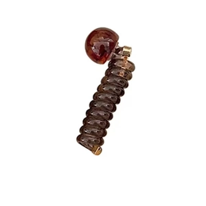 Brown amber spiral telephone wire hair tie with golden metal and ball beads
