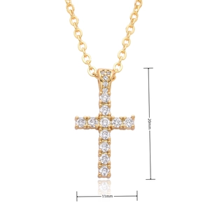 Macro shot of gold cross pendant with cubic zirconia inlay and 20mm by 11mm dimensions